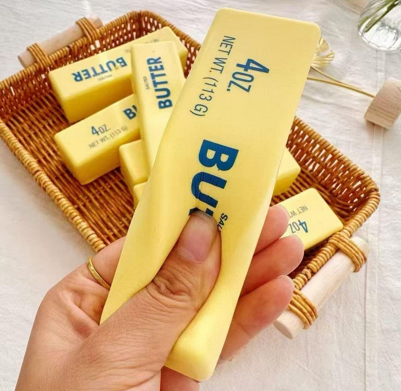 Hand squeezing the butter squishy